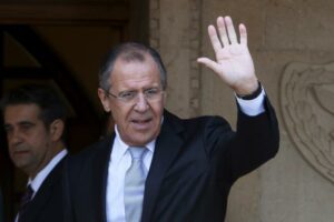 Russian Foreign Minister Sergei Lavrov waves to media at the Presidential Palace  in Nicosia, Cyprus December 2, 2015. REUTERS/Yiannis Kourtoglou